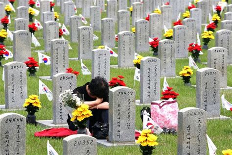 A Korean Woman Remembering A Fallen Hero During Korean Memorial Day