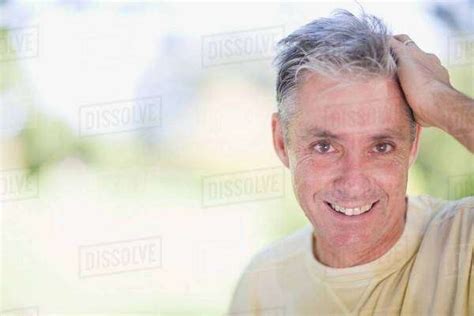 Man Smiling Outdoors Stock Photo Dissolve
