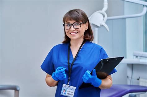 Premium Photo Portrait Of Female Dentist In Office Middle Aged Doctor