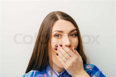 Woman With Hand Over Her Mouth Stock Image Colourbox