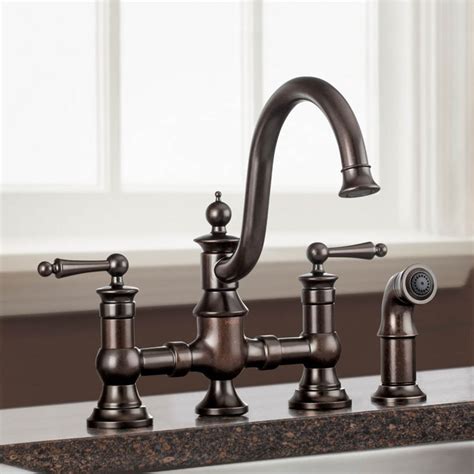 An oil rubbed bronze kitchen faucet integrates bronze with light and dark accents, resulting in an antique appearance. Moen S713ORB Waterhill Two Handle Kitchen Faucet in Oil ...