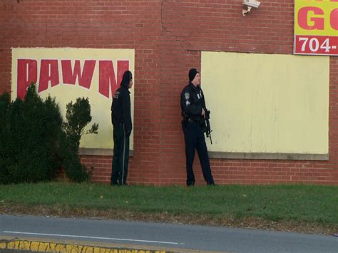 Two Arrested After Man Barricaded Himself Inside Gun Shop