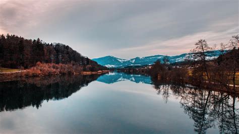 Download 1366x768 Wallpaper Lake Reflections Mountains Sunset