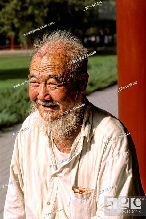 Colorful Portrait Of Elderly Chinese Man With Beard In Beijing China