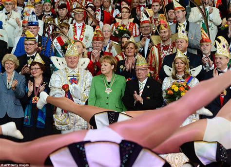 Angela Merkel Looks Away As Female Dancers Perform The Splits Upside