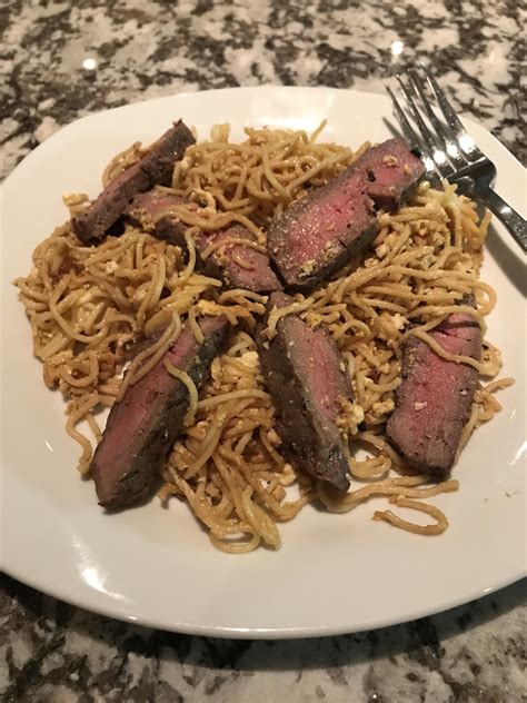 Slice the steak into thin pieces and serve with the karashi soy sauce. This abomination is everything I wanted. Eggs, fried spaghetti, soy sauce, and leftover steak ...