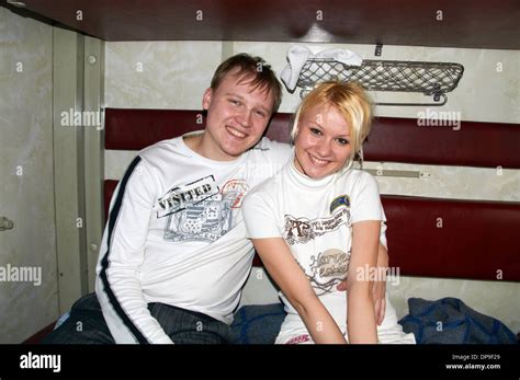 Young Russian Couple In A Train Carriage 2nd Class Or Kupeyny On