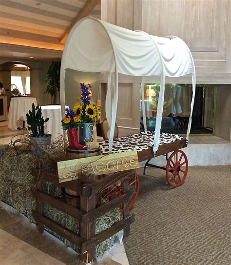 Western party decorations. Chuck wagon's used for check-in tables