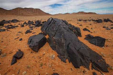 Pitch Black Rocks In The Desertklein Aus Vista Namibia Stock Photo
