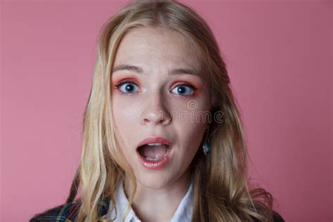 Confused Surprised Young Blonde Girl In Plaid Jacket Opened Her Mouth
