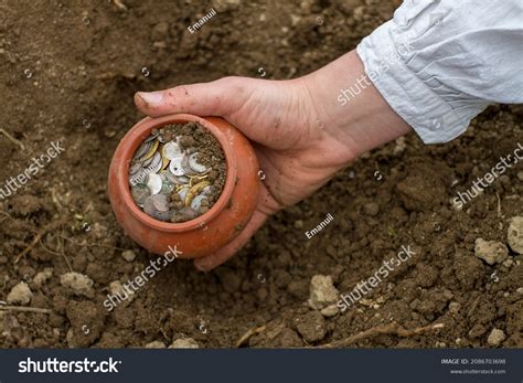 Male Pale Hand Digging Buried Treasure Stock Photo 2086703698
