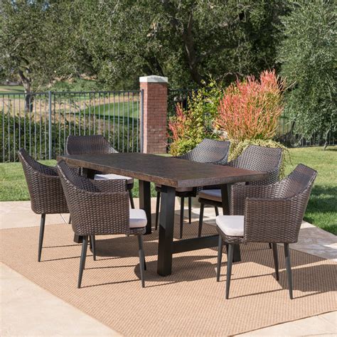 Porter Outdoor 7 Piece Wicker Dining Set With Light Weight Concrete