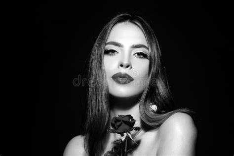 Woman Lips With Red Lipstick And Beautiful Red Rose On Black Stock