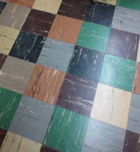 A Bathroom Floor With Multicolored Tiles On It