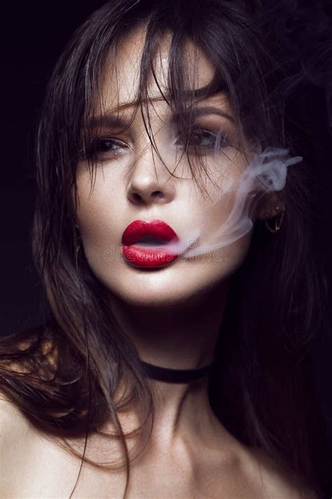 Beautiful Brunette Girl With Bright Makeup Red Lips Smoke From Mouth