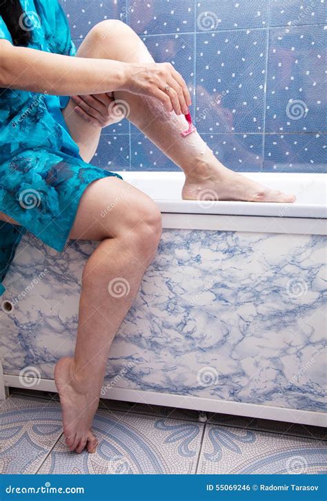Woman Shaving Leg Sitting In The Bathroom Stock Photo Image Of