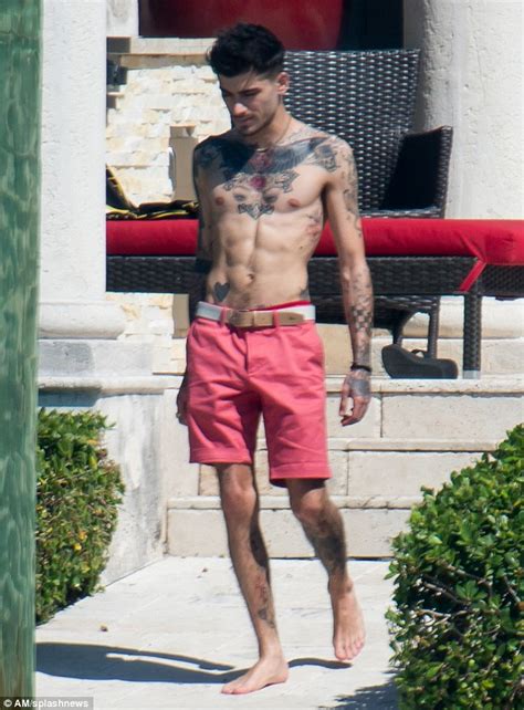 zayn malik displays his tattoos as he goes shirtless in miami daily mail online