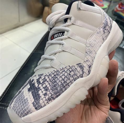 A white midsole, clean translucent outsole and red hits on the insole and jumpman logo on the outsole completes the design. Air Jordan 11 Low Snakeskin Light Bone CD6846-002 Release ...