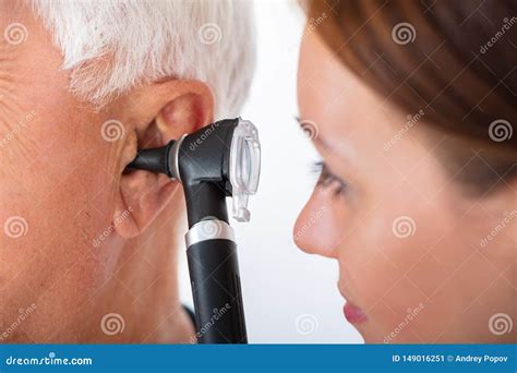 Doctor Examining Patient`s Ear With Otoscope Stock Image Image Of