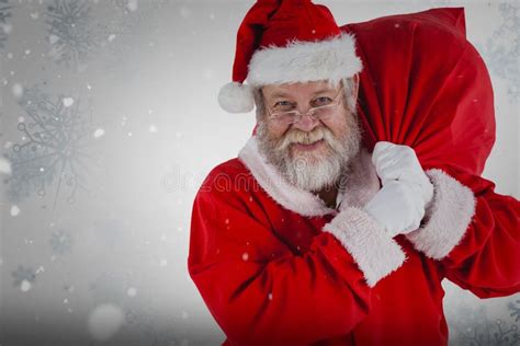 Composite Image Of Portrait Of Santa Claus Holding Christmas Sack Stock