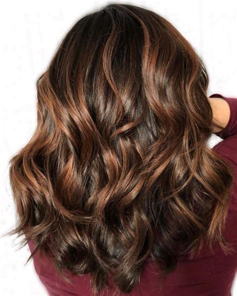Your stylist should choose a darker shade of caramel in between your natural hair color and the actual caramel shade for the perfect fade effect. 60 Looks with Caramel Highlights on Brown and Dark Brown Hair