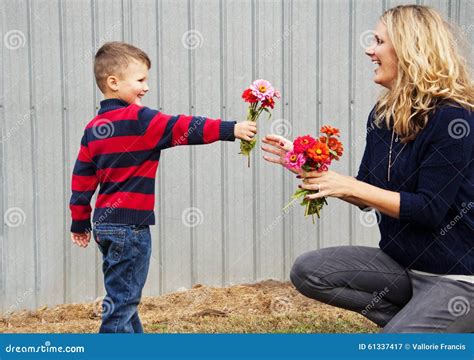 Boy Child Giving Mom Flowers Stock Image Image Of Mother Little