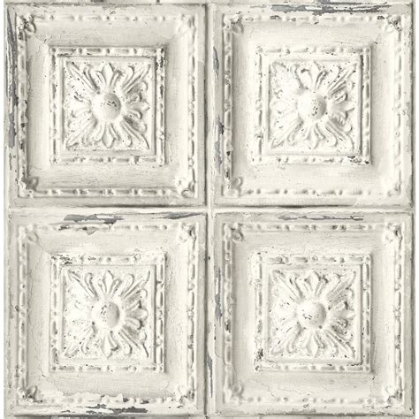 Four Square White Tiles With Ornate Designs On The Sides And One Is