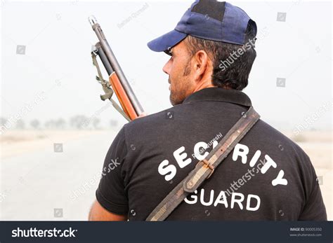 Security Guard Holding Gun Stock Photo 90005350 Shutterstock