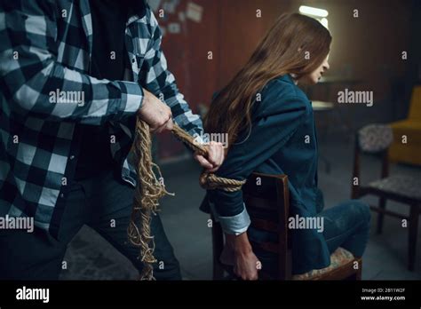 Maniac Kidnapper Ties His Female Victim With Rope Stock Photo Alamy