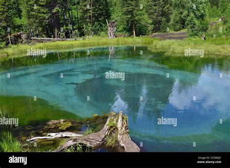 Amazing Blue Geyser Lake In The Mountains Of Altai Russia Stock Photo