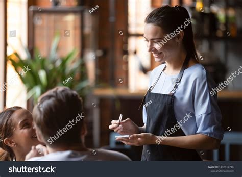 Smiling Female Waitress Take Order Talk Stock Photo 1492617746