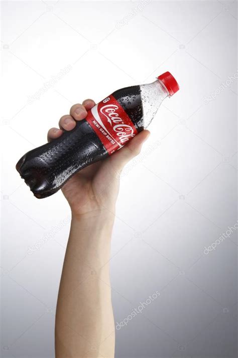 Hand Holding Coca Cola Stock Editorial Photo © Eskaylim 81881616