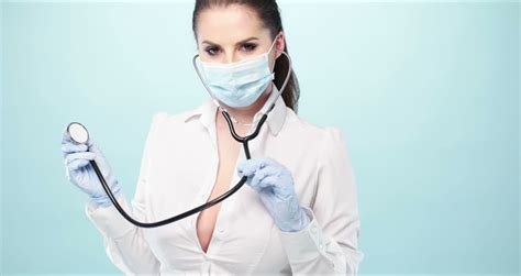 Video Of Sexy Nurse Wearing Mask On Blue 4k Stock Footage Video 8822851 Shutterstock
