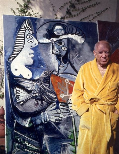 A Man Standing In Front Of A Painting With A Yellow Robe Over His Body