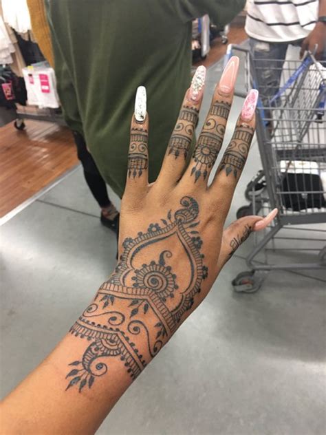 Six pairs of henna decorated female hands arranged in a circle on a colorful background. Pin by Amea on Tattoos | Rihanna hand tattoo, Henna tattoo ...