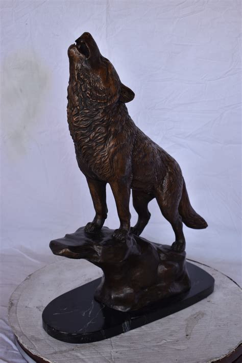 Howling Wolf at Edge of a Cliff Bronze Statue - Size: 9