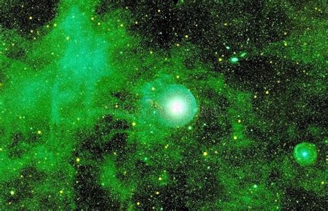 Distant Green Galaxy With Stars And Nebulae Background Stock Image