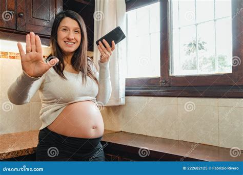 Pregnant Latina Woman Asking The Camera To Stop While Recording A Voice