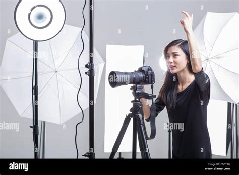 Photographer Taking Picture In Studio Stock Photo Alamy
