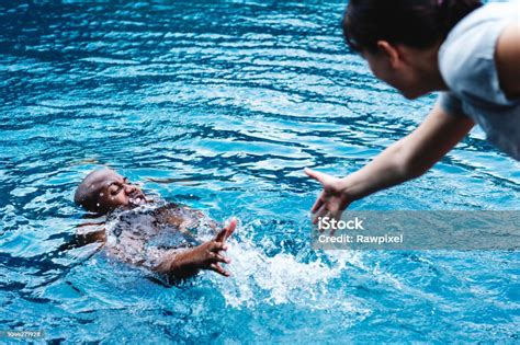 Man Being Rescued From The Water Stock Photo Download Image Now