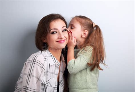 Happy Cute Kid Girl Whispering Secret To Her Funny Grimacing Stock Photos Free Royalty Free