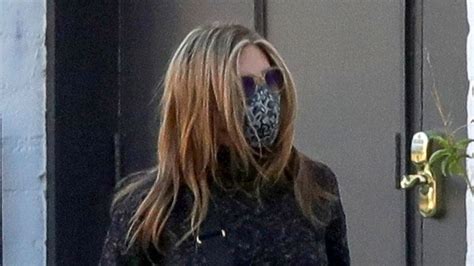Jennifer Aniston Wore A Wolford Face Mask With S Big Bag Trend