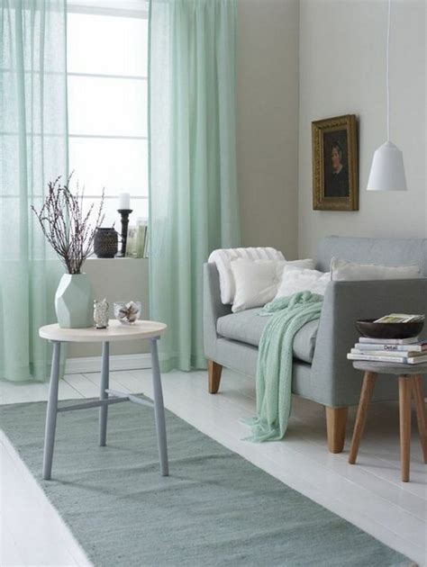 The earthy sage color on the island helps ground and soften this modern white and gray kitchen. 30 Green And Grey Living Room Décor Ideas - DigsDigs