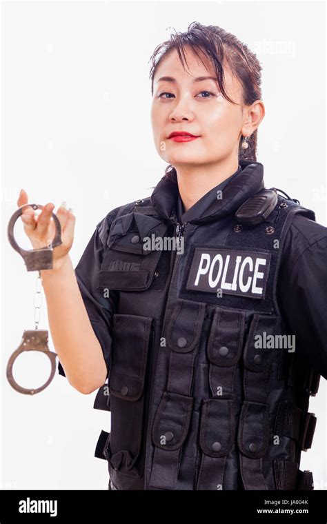Chinese Female Police Officer Holding Handcuffs Stock Photo 143829635