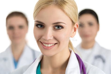 portrait of female doctor surrounded by medical team stock image image of pretty cheerful