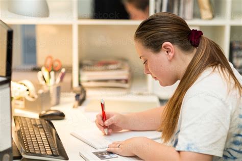 Image Of Teenage Girl At Desk Writing Notes Austockphoto