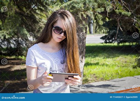Long Haired Girl Enjoys The Tablet Stock Image Image Of Hair Online