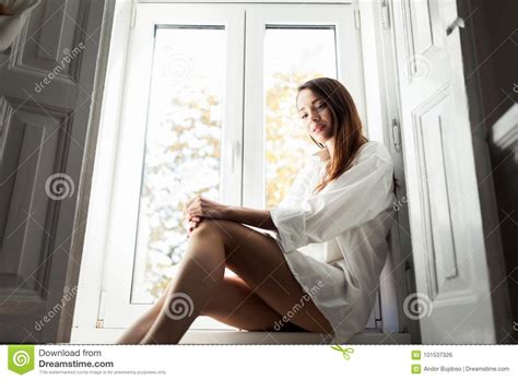 Beautiful Young Woman Sitting By Window Alone Stock Photo Image Of