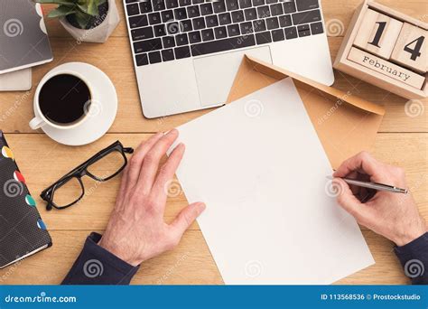 Man Writing Letter At Workplace While Working Stock Photo Image Of