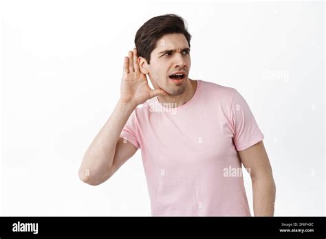 Gossip Man Trying To Overhear Someone Hold Hand Near Ear And Lean